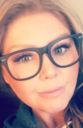 woman wearing black glasses 2023