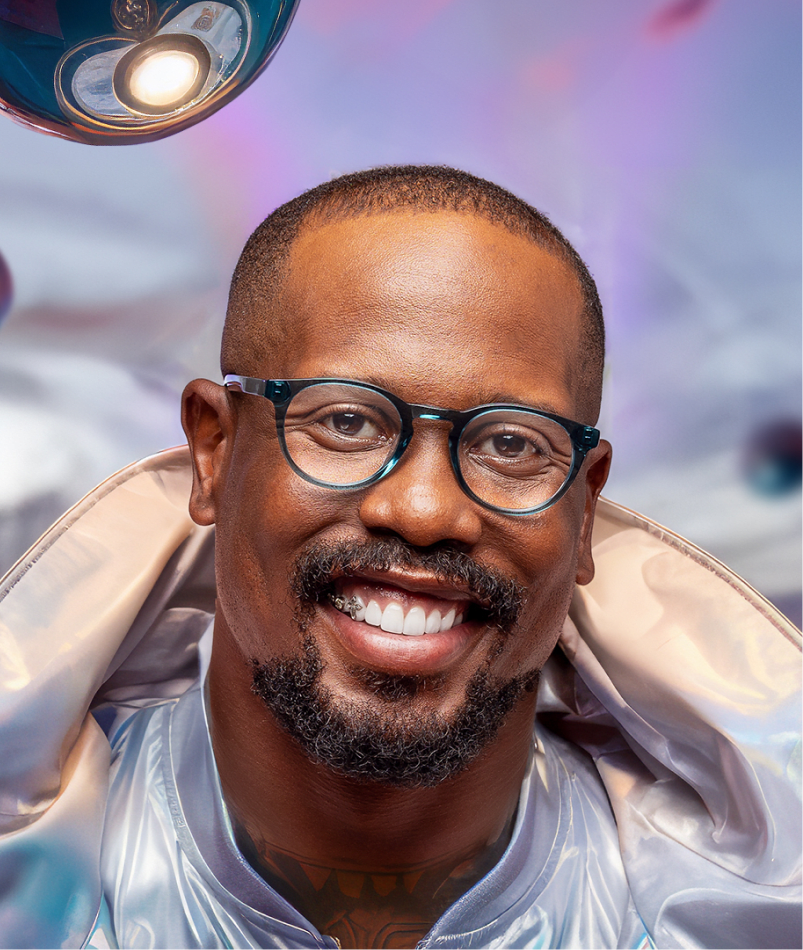 Von Miller showcasing classic round-frame glasses from the GlassesUSA collection in a modern setting.