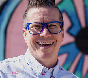 Man wearing prescription eyeglasses from GlassesUSA, up to 50% off prescription glasses online