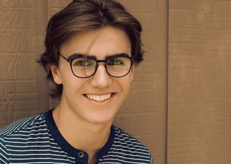 Man wearing prescription glasses from GlassesUSA eyewear at discounted prices
