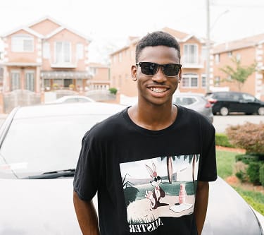 Man wearing sunglasses from GlassesUSA eyewear collection, affordable online eyewear