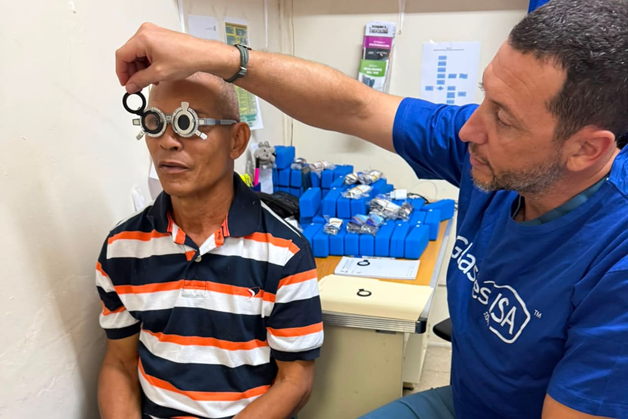 Medical team in Panama providing eye exams and fitting donated eyeglasses to community patients