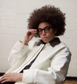 Olivia Miles in a white blazer