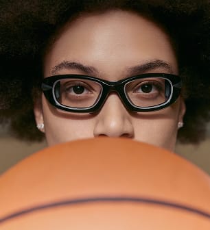 Olivia Miles holding a basketball