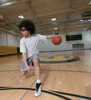 Olivia Miles adjusting her glasses on the court