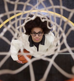 Olivia Miles wearing glasses