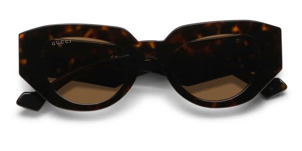The Gucci GG1421S is a stylishly chunky sunglasses frame exuding