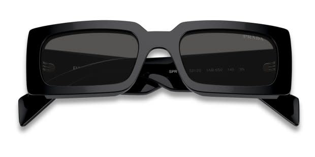 Prada PRA07S black frame with dark grey lenses. Lenses provide 100