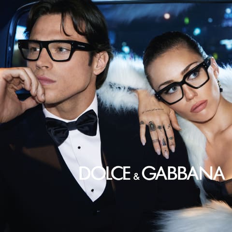 Man and woman wearing Dolce & Gabbana glasses in a luxury night setting